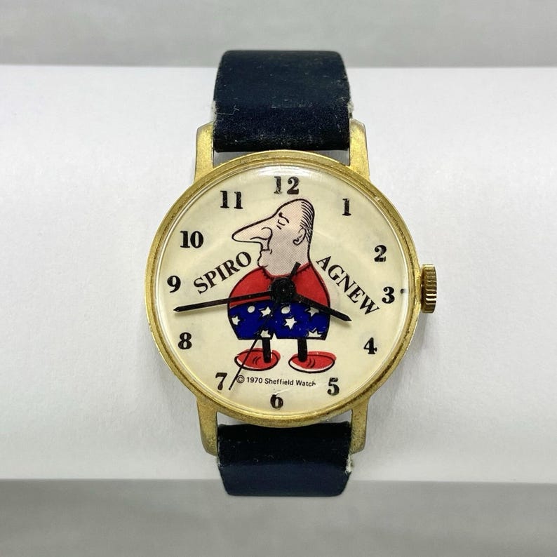 Reloj de pulsera Sheffield Spiro Agnew vintage de 1970, movimiento mecánico, correa azul oscuro. imagen 1