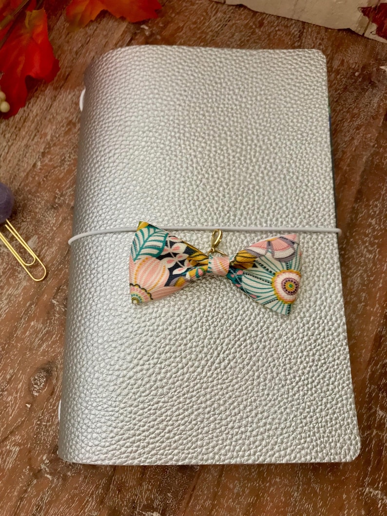 midori or travelers notebook bow charm Navy pink yellow white floral design grosgrain ribbon Gold hardware Planner