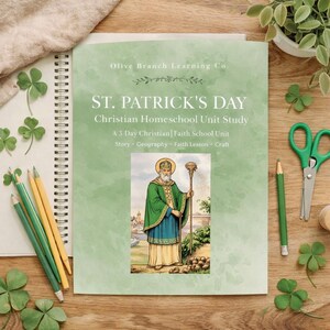 May include: A St. Patrick's Day Christian Homeschool Unit Study book with the text "Olive Branch Learning Co." and "ST. PATRICK'S DAY Christian Homeschool Unit Study". The book features an illustration of St. Patrick. Green and yellow pencils, scissors, and shamrocks are also visible.