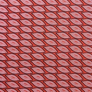 May include: Red fabric with a white and black geometric pattern of overlapping teardrop shapes. The pattern is made up of small white dots.