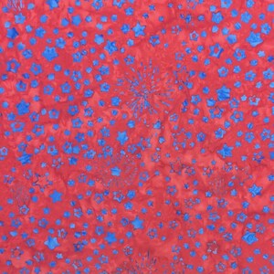 May include: Red fabric with a pattern of blue stars and starbursts. The stars vary in size and shape, creating a dynamic and festive design. The fabric has a mottled appearance, adding depth to the overall look. This fabric is suitable for various craft projects.