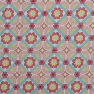 May include: A repeating pattern of pink, red, yellow, and light blue floral and geometric shapes. The design features pink flowers with yellow centers, set within light blue diamond shapes, and smaller red flowers.