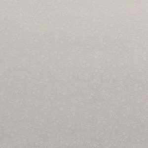 May include: A light gray fabric with a delicate, repeating pattern of small white floral sprigs. The design is evenly distributed across the surface, creating a subtle, textured appearance. The overall effect is soft and muted.