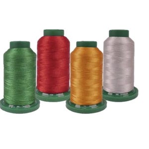 May include: Four spools of thread in various colors: green, red, gold, and silver. Each spool has a green base and cap. The threads are tightly wound, showcasing the vibrant colors.