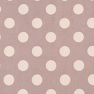 May include: A light brown fabric with a white polka dot pattern.