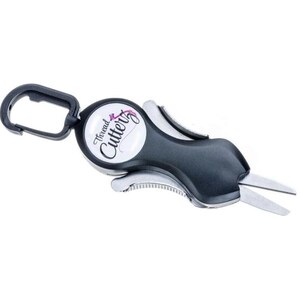 May include: A black and silver thread cutter with a carabiner clip. The cutter has a white circle with the text "Thread Cutter" in black cursive lettering and a pink thread design.