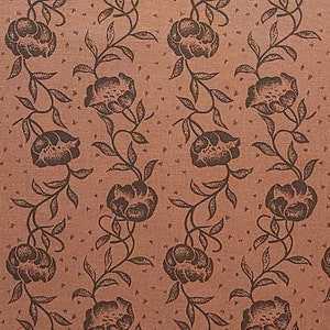 May include: A seamless fabric pattern with a repeating design of brown flowers and vines on a light brown background.