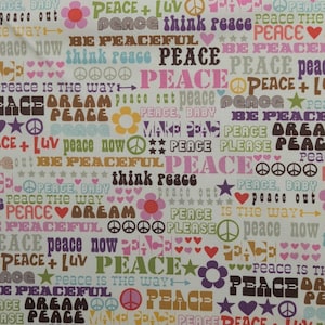 May include: A white fabric with a repeating pattern of the word "PEACE" in various colors and fonts, along with peace symbols, hearts, and flowers. The words "peace out", "peaceful", and "dream" are also visible.