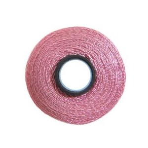May include: A spool of pink embroidery floss.