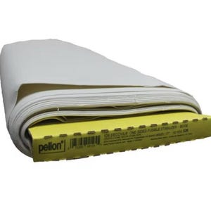 May include: A roll of Pellon 525 Decovil one-sided fusible stabilizer in beige. The roll is 17 inches wide and 10 yards long. The packaging is yellow with black text.