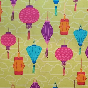 May include: A repeating pattern of colorful paper lanterns in shades of pink, purple, orange, and teal, with decorative tassels. The lanterns are set against a light yellow background with white cloud shapes.