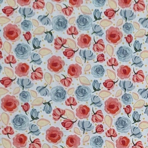 May include: A white fabric with a repeating pattern of pink and blue roses. The roses are stylized and have a watercolor effect.