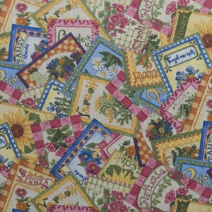 May include: A fabric pattern featuring a collage of floral designs and seed packet illustrations. The design includes sunflowers, daisies, and other flowers, with text labels like "Pansy Seeds" and "Forget-me-nots" in a colorful, vintage style.