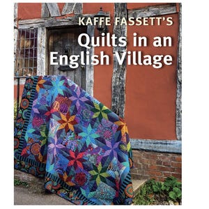 May include: A book cover featuring a colorful quilt with a star pattern, leaning against a brick wall. The title of the book is "Kaffie Fassett's Quilts in an English Village."