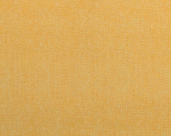 May include: Close-up of a textured, yellow fabric. The fabric has a woven appearance with a subtle, irregular pattern. The color is a warm, golden yellow, and the texture appears soft and slightly rough.