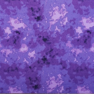 May include: Purple fabric with a marbled pattern. The fabric has a light purple background with darker purple and black marbling throughout.
