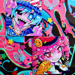 May include: Two colourful cartoon character illustrations printed on square cards. The first card features a blue-haired character with a red, white and blue hat, wearing a blue and white striped shirt. The second card features a pink-haired character with a red hat and a yellow smiley face, wearing a black and white shirt. Both characters are surrounded by confetti.