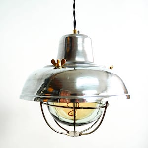 Small vintage industrial pendant light in polished steel with lampshade.