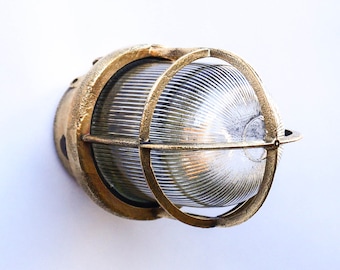 Old small wall lamp in brass and streaked glass