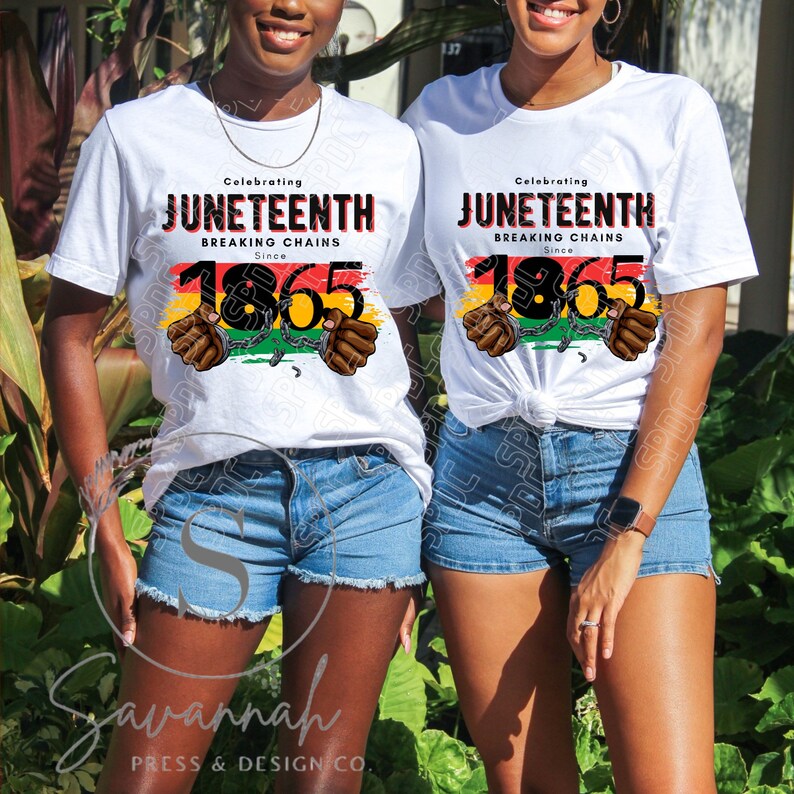 May include: Two white t-shirts with the text "Celebrating Juneteenth Breaking Chains Since 1865" in black and red lettering. The number 1865 is surrounded by a red, yellow, green, and black striped design with a chain and two hands breaking free.