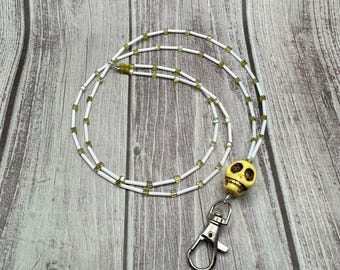 Regina yellow skull lanyard
