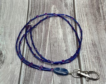 Lydia - Blue lanyard with purple accents.