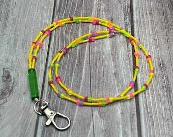 Adaline Yellow lanyard with neon accent colors & green focal.