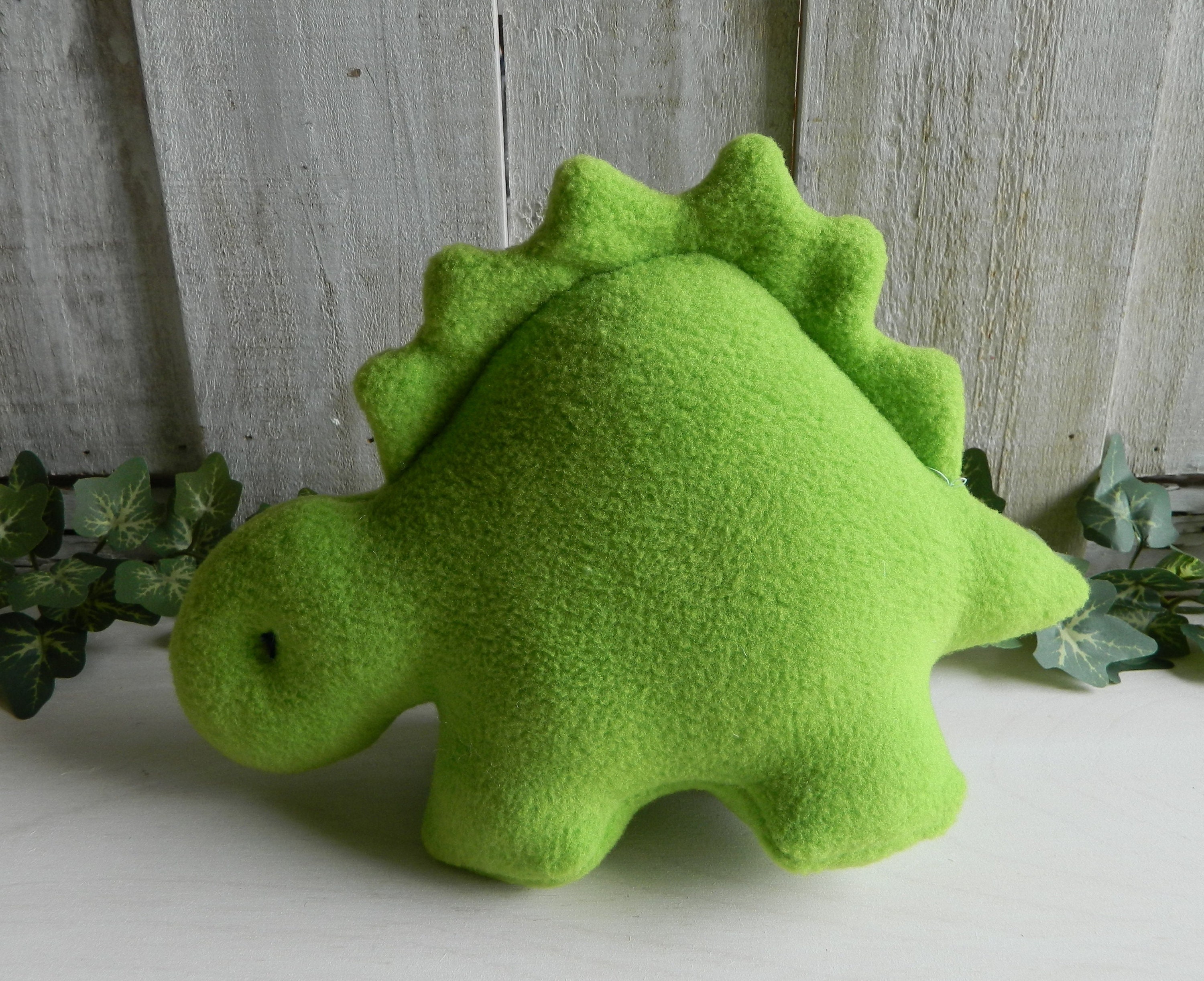stuffed green dinosaur