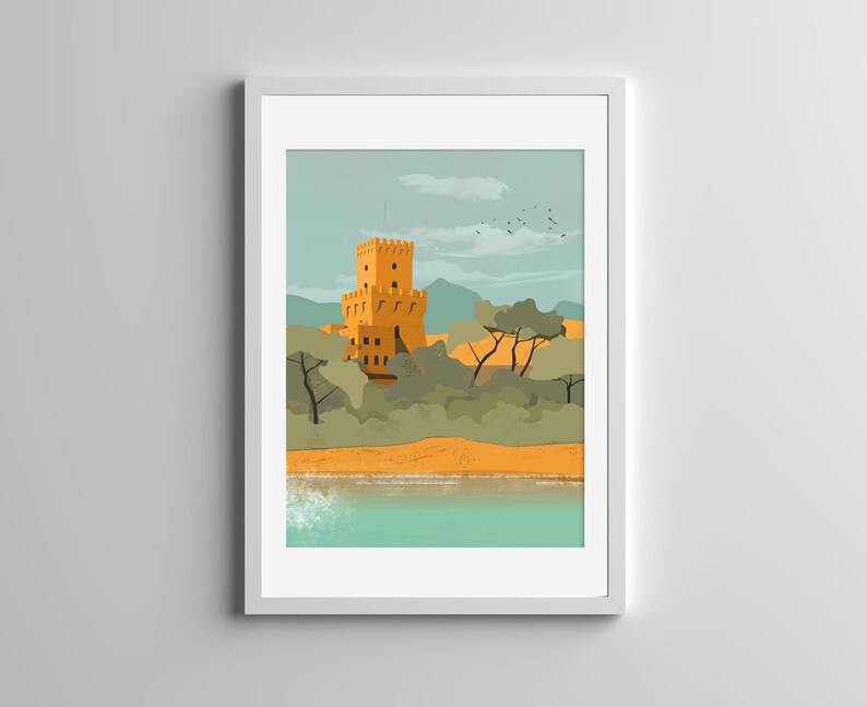 May include: A framed art print featuring a yellow stone tower with battlements situated among green trees and hills near a sandy beach and turquoise water. The sky is a pale blue with soft clouds and a small flock of birds flying in the distance.