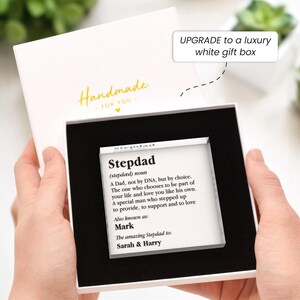 May include: A white gift box with a black interior holds a clear acrylic block. The block features the definition of "Stepdad" and the names "Mark", "Sarah & Harry". The box is labeled "Handmade - FOR YOU" in gold lettering.