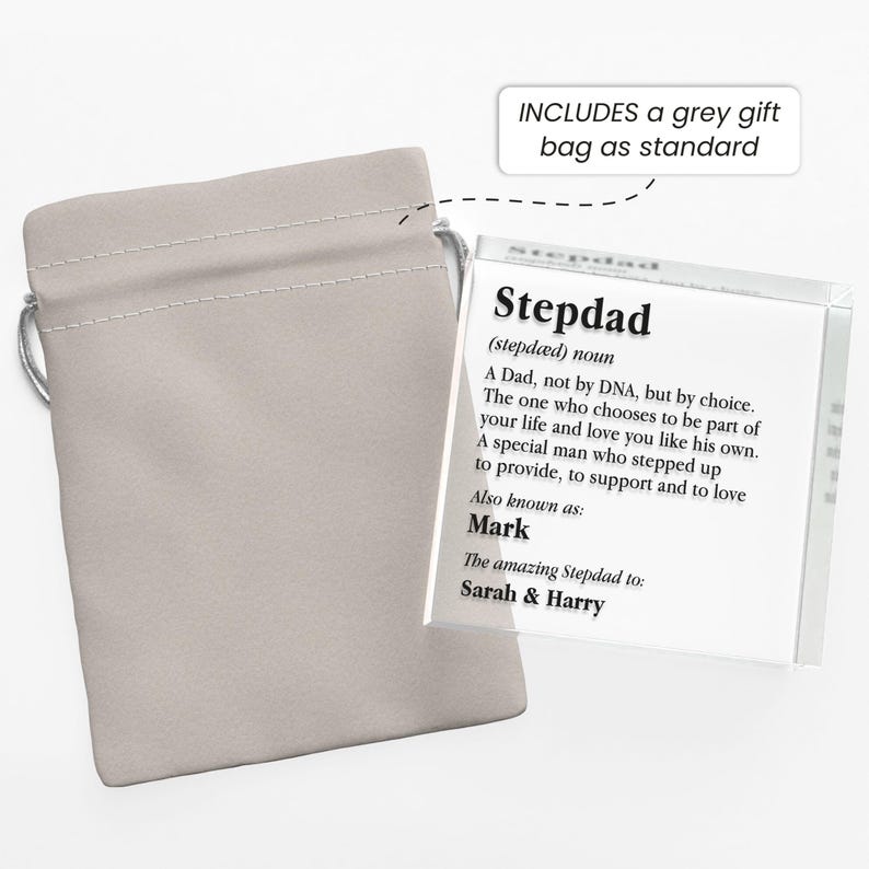 May include: A clear acrylic block with the definition of "Stepdad" and the name "Mark" is displayed next to a light gray drawstring bag. The text includes the phrase "The amazing Stepdad to: Sarah & Harry."