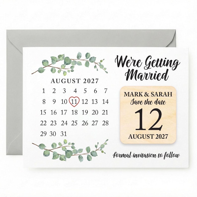 May include: A save-the-date card featuring a calendar highlighting August 11, 2027, with the text "We're Getting Married." A wooden accent displays "Mark & Sarah" and "August 12, 2027." Eucalyptus sprigs decorate the card.