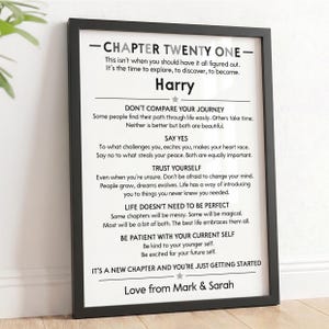 May include: A black framed wall art print featuring white background with black text titled CHAPTER TWENTY ONE. It includes personalized name Harry, inspirational advice, and a closing message Love from Mark & Sarah with star icons.