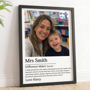 May include: A framed wall print featuring a photograph of an adult and a child smiling. Below the photo, the text reads: Mrs Smith, Difference Maker (noun), A dedicated person who makes a big impact every day, and Love Harry, in black font.