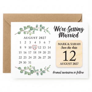 May include: A save-the-date card with a calendar highlighting August 12, 2027, with a heart around the 11th. The card features the text "We're Getting Married" and "Mark & Sarah Save the date 12 August 2027". Includes a brown envelope.