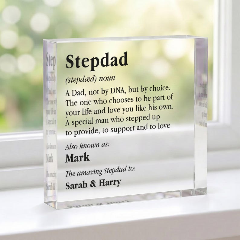 May include: A clear acrylic block with the word "Stepdad" and its definition printed in black. The block also includes the names "Mark", "Sarah & Harry". A thoughtful gift for a stepfather.