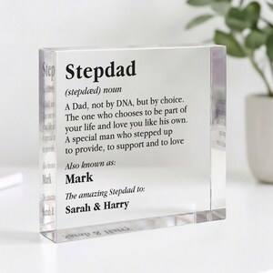 May include: A clear acrylic block with the word "Stepdad" and its definition printed in black. The definition describes a stepfather's role in a family. The block also includes the names "Mark", "Sarah & Harry".