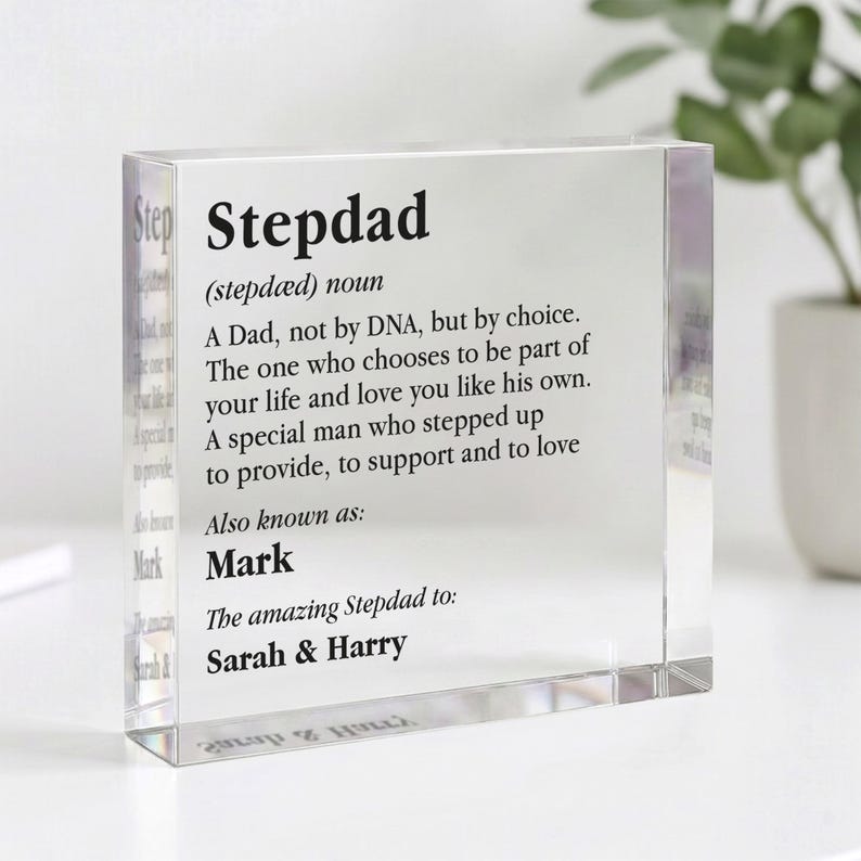 May include: A clear acrylic block with the word "Stepdad" and its definition printed in black. The definition describes a stepfather's role in a family. The block also includes the names "Mark", "Sarah & Harry".