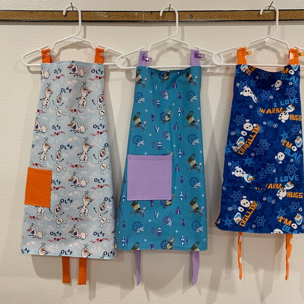 Girl's apron, Olaf, Frozen, Sven, warm hugs, chillin', blue, white, orange, snowflakes, ice, pocket, reversible, cooking, play, lined