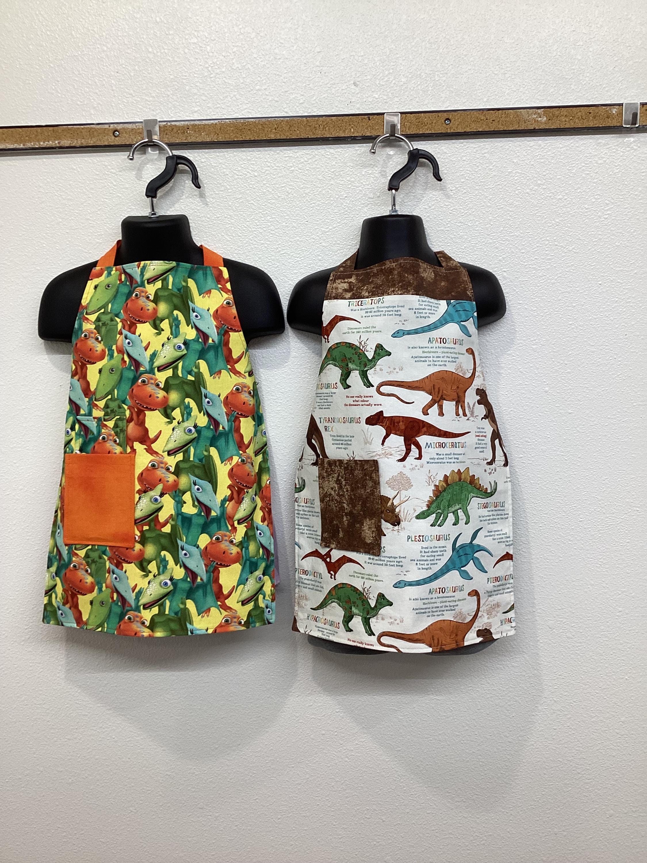 Dino child's apron, dinosaur, prehistoric, orange, green, blue, yellow, flying, pocket, Reversible, Fun, painting, cooking, play, bookmark