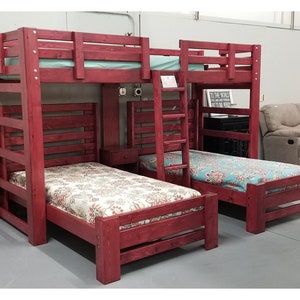 May include: A red wooden bunk bed with a ladder and a built-in shelf. The bed is made up with floral patterned bedding.