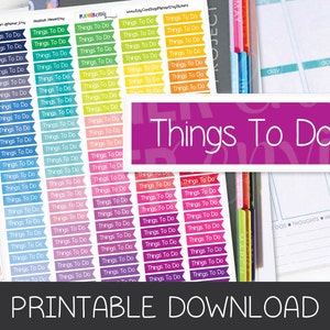 May include: Printable planner stickers with a rainbow of colors. The stickers are rectangular with rounded corners and feature the text "Things To Do" in white. The stickers are designed for use in a planner or journal.