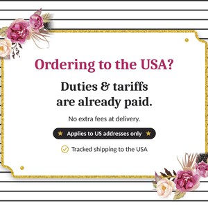 May include: A rectangular sign with a gold border and black and white horizontal stripes in the background. Pink and white floral accents decorate the corners. The text reads: Ordering to the USA? Duties & tariffs are already paid.