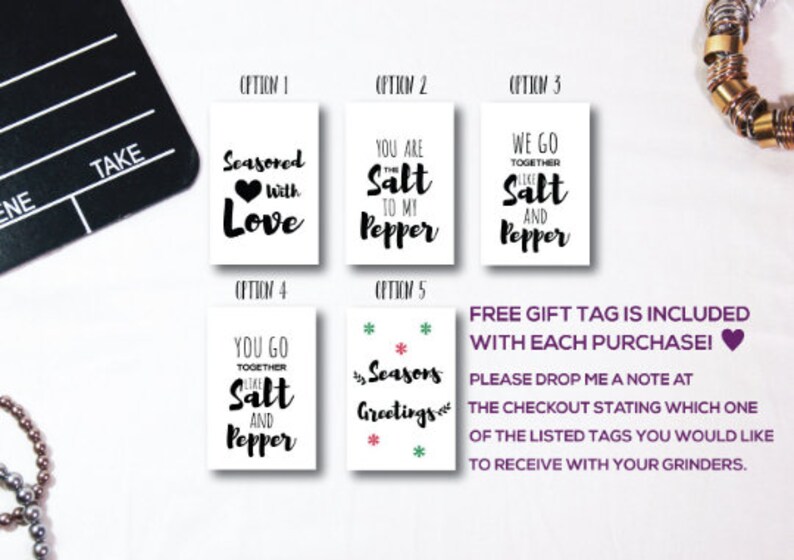 May include: Five rectangular white gift tags with black text. Option 1: Seasoned with Love. Option 2: You are the Salt to my Pepper. Option 3: We go together like Salt and Pepper. Option 4: You go together like Salt and Pepper. Option 5: Seasons Greetings.