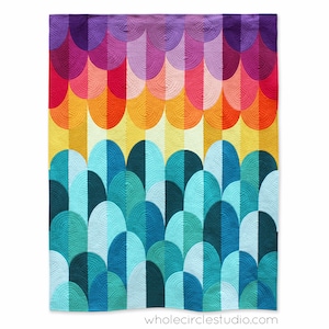 May include: A colourful quilt featuring a pattern of overlapping semicircles in shades of purple, pink, orange, yellow, blue, and green. The quilt is made up of rows of semicircles, with the colours gradually transitioning from purple to green.