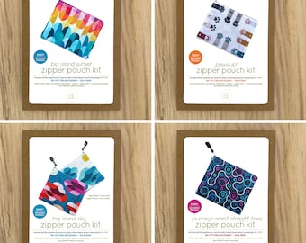 May include: Four different zipper pouch kits with colorful fabric designs. Each kit includes all the supplies needed to make a small zipper pouch measuring 7" x 7". The designs include "Big Island Sunset", "Paws Up!" , "Big Island Sky", and "Journeys Aren't Straight Lines".