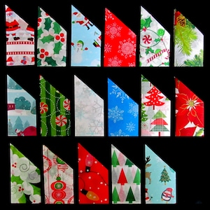 May include: A selection of folded Christmas gift wrap samples in various festive designs. Patterns include Santa, holly, snowflakes, and Christmas trees. The colour scheme is predominantly red, green, blue, and white, creating a vibrant and seasonal display.
