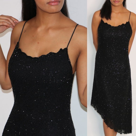 black dress with scalloped neckline
