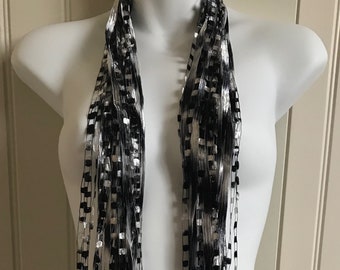 Italian Ladder Ribbon Scarf, Classic Black and White. These scarves are a great addition to any wardrobe.