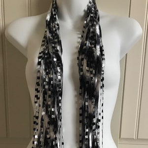 Italian Ladder Ribbon Scarf, Classic Black and White. These scarves are a great addition to any wardrobe.